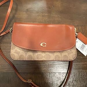 Brand new coach purse never used. Received as a gift and will not use it